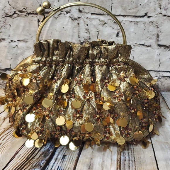 GaBaangs Handbags - EUC GaBaangs gold pouch bag